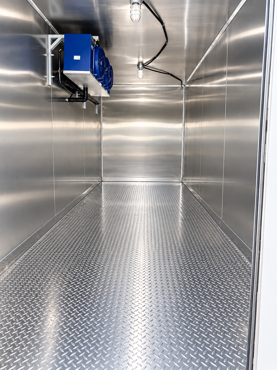 Owner-supplied 20 ft refrigerated-trailer interior with stainless steel walls and cooling equipment